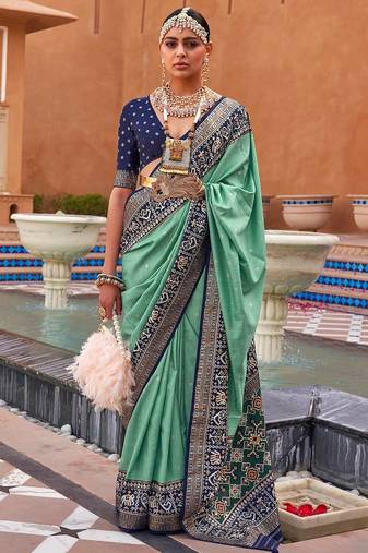 Sea green woven design zari silk blend patola saree