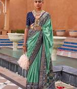 Sea green woven design zari silk blend patola saree