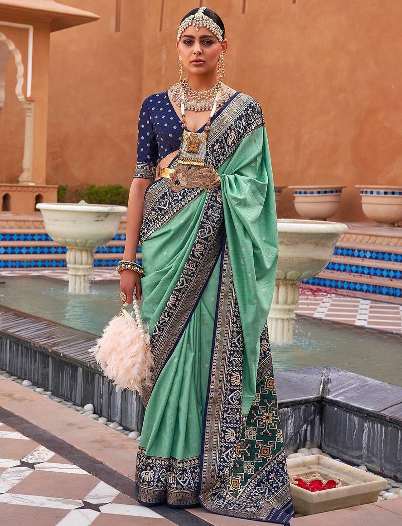 Sea green woven design zari silk blend patola saree