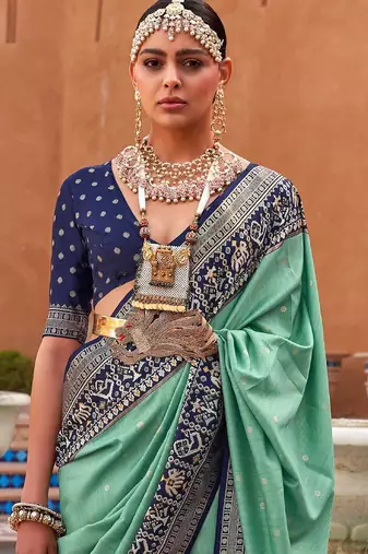 Sea green woven design zari silk blend patola saree