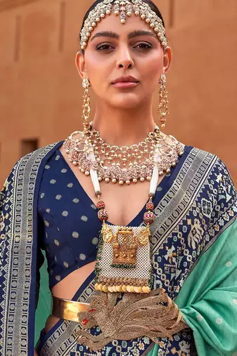 Sea green woven design zari silk blend patola saree