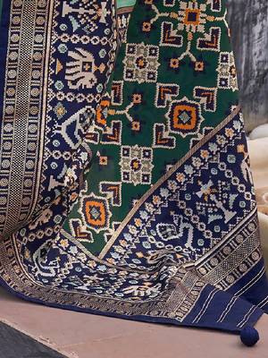 Sea green woven design zari silk blend patola saree 4