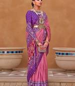 Mauve ethnic motifs woven design zari patola saree