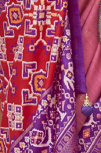 Mauve ethnic motifs woven design zari patola saree