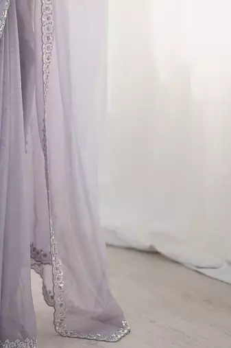 lavender embellished border sequinned net saree
