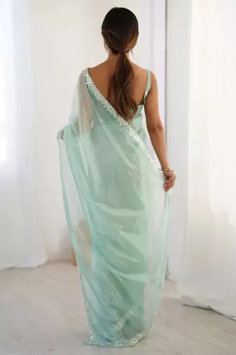 turquoise beads and stones embellished net party wear saree