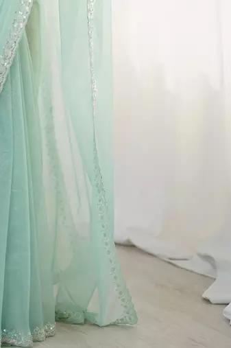 turquoise beads and stones embellished net party wear saree