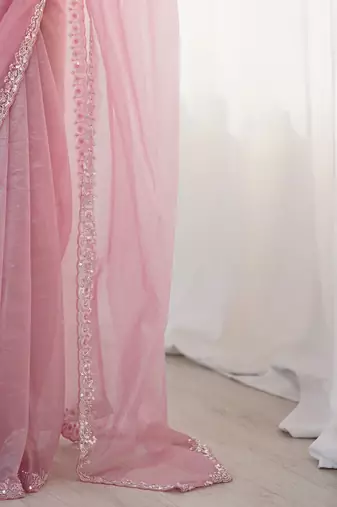 pink embellished border sequinned net saree