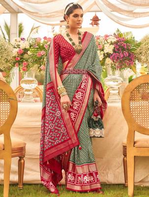 Green ethnic motifs woven design zari patola saree 1