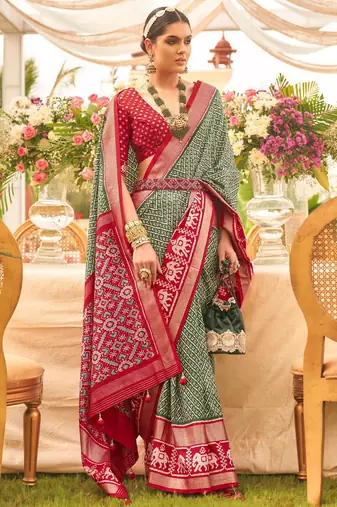 Green ethnic motifs woven design zari patola saree