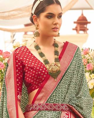 Green ethnic motifs woven design zari patola saree 2
