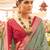 Green ethnic motifs woven design zari patola saree