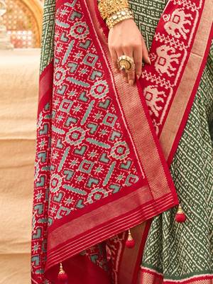 Green ethnic motifs woven design zari patola saree 5