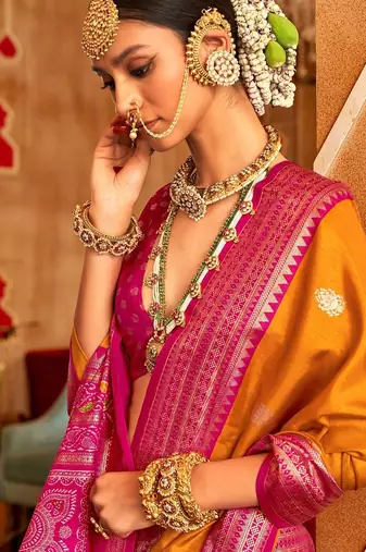 Orange ethnic motifs zari patola saree