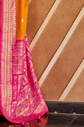 Orange ethnic motifs zari patola saree