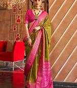 Olive ethnic motifs woven design zari  patola saree