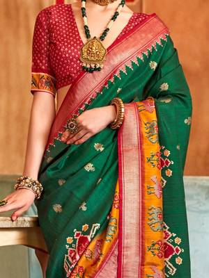 Green woven design zari patola saree 4