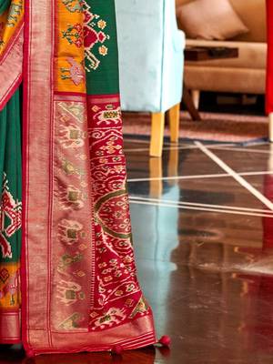 Green woven design zari patola saree 5