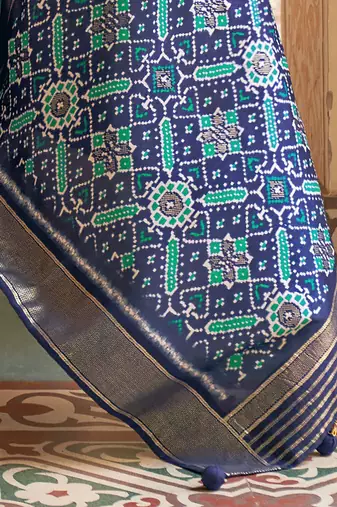 Navy blue ethnic motifs printed ikat saree