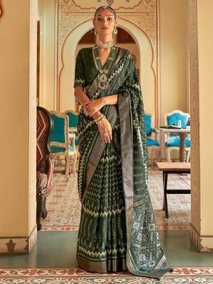 Green ethnic motif printed zari ikat saree 1