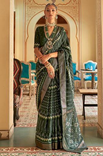 Green ethnic motif printed zari ikat saree