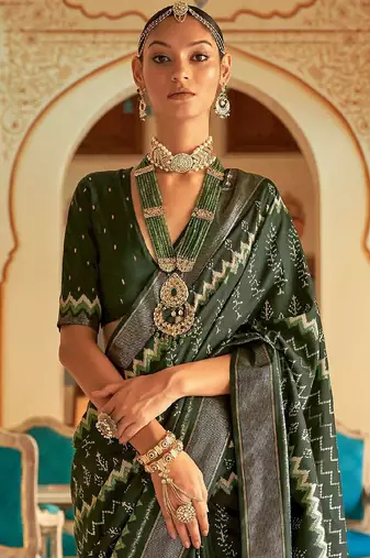 Green ethnic motif printed zari ikat saree