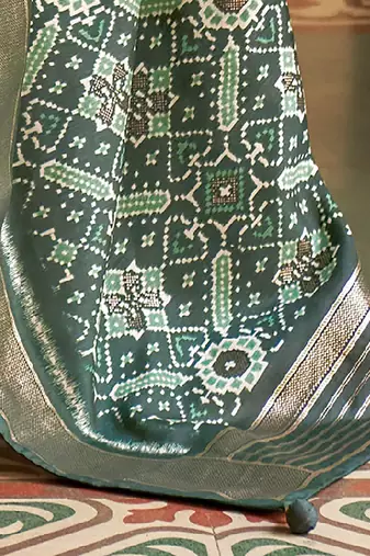 Green ethnic motif printed zari ikat saree