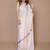 cream ethnic motifs printed satin saree