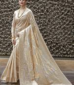 cream-coloured & gold-toned floral woven design zari banarasi silk blend saree