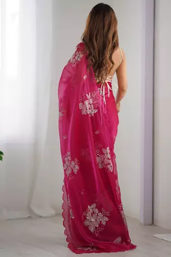 pink ethnic motifs sequinned organza saree