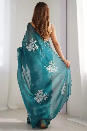 teal ethnic motifs sequinned organza saree