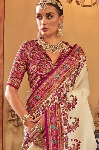 Cream ethnic motifs printed saree