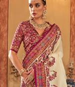 Cream ethnic motifs printed saree