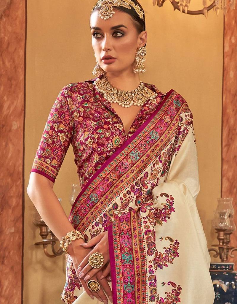Cream ethnic motifs printed saree