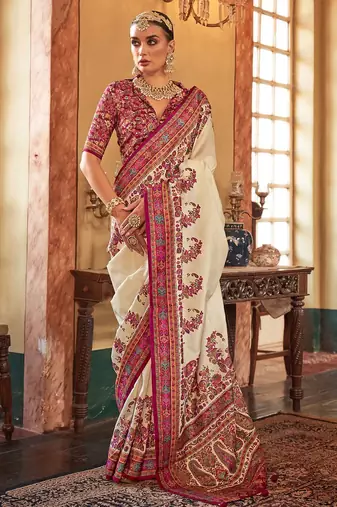 Cream ethnic motifs printed saree