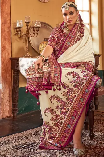 Cream ethnic motifs printed saree