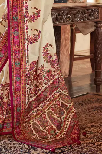Cream ethnic motifs printed saree