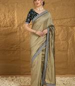 Olive ethnic motifs embroidered silk blend saree with matching blouse