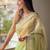 Green embroidered embellished tissue saree