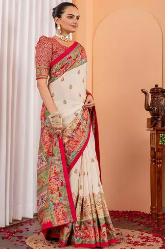 Cream ethnic motifs silk blend saree