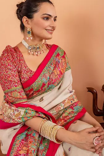Cream ethnic motifs silk blend saree