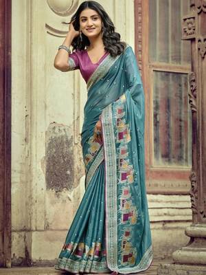 Teal ethnic motifs embroidered silk blend saree 1