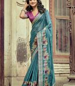 Teal ethnic motifs embroidered silk blend saree