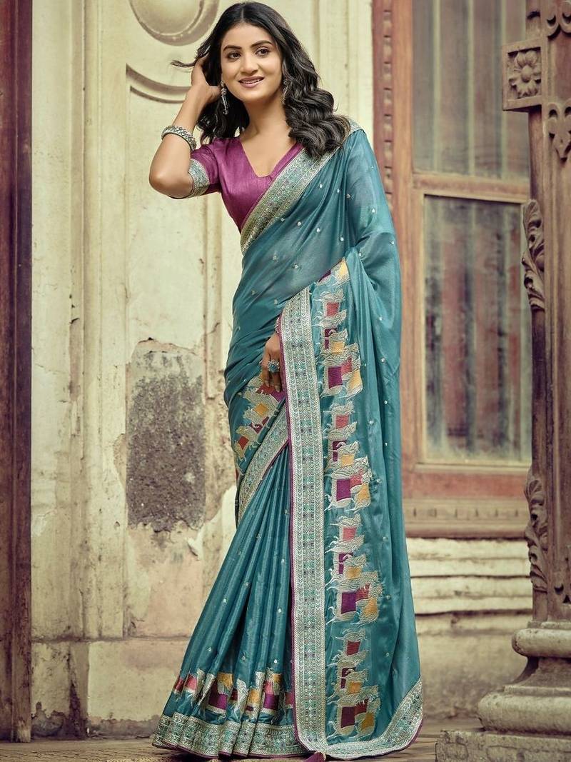 Teal ethnic motifs embroidered silk blend saree