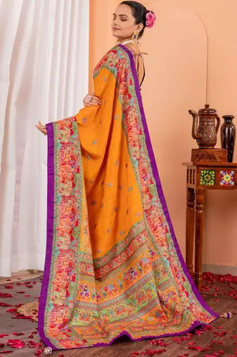 Mustard ethnic motifs silk blend saree