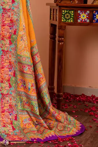 Mustard ethnic motifs silk blend saree
