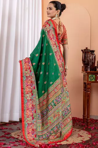 Green ethnic motifs silk blend saree