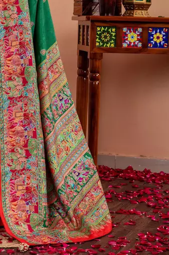 Green ethnic motifs silk blend saree