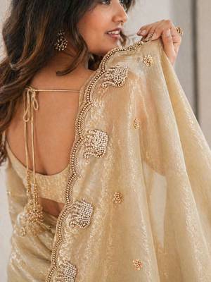 gold ethnic motifs beads and stones satin heavy work saree 2
