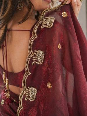 maroon ethnic motifs beads and stones satin heavy work saree 5